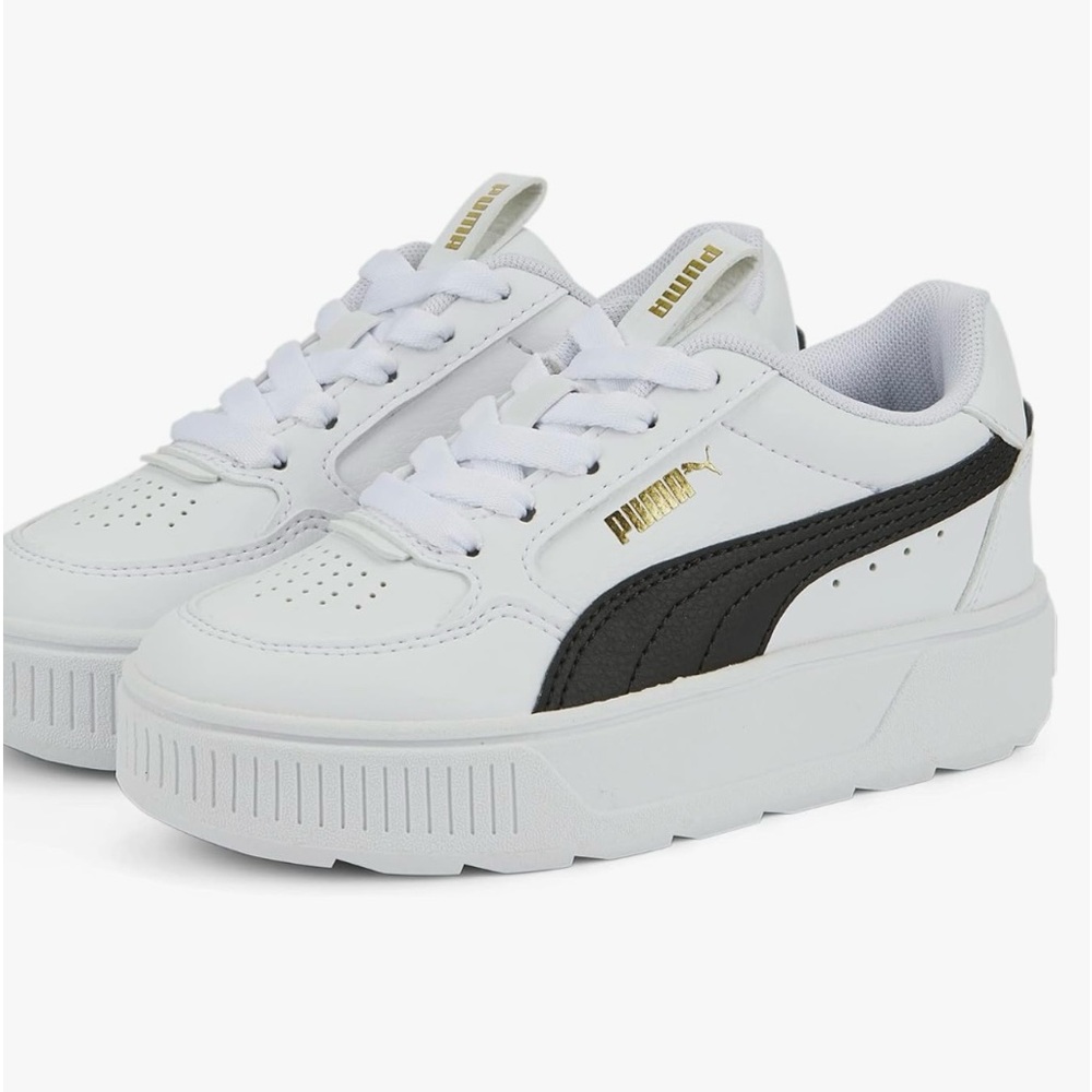 White Pumas in 5.5 Youth size / equivalent to a Women’s size 7 worn once .